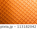 Spelt waffle with a grid pattern as background 113182042