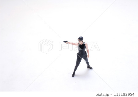girl in an action movie film shootout pose 113182954