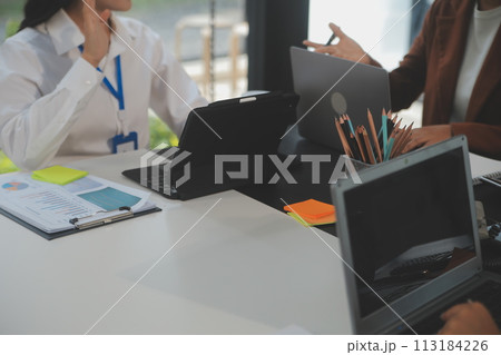 Business team meeting working with new startup project, discussion and analysis data the charts and graphs. Digital tablet, calculator, laptop computer using, Business finance and accounting concept. Business team meeting working with new startup project, discussion and analysis data the charts and graphs. Digital tablet, calculator, laptop computer using, Business finance and accounting concept. 113184226