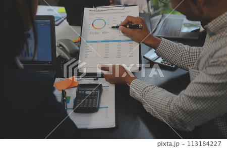 Business team meeting working with new startup project, discussion and analysis data the charts and graphs. Digital tablet, calculator, laptop computer using, Business finance and accounting concept. Business team meeting working with new startup project, discussion and analysis data the charts and graphs. Digital tablet, calculator, laptop computer using, Business finance and accounting concept. 113184227