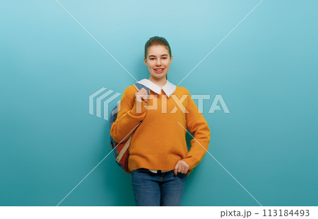 teenager on color paper wall background teenager on color paper wall background 113184493