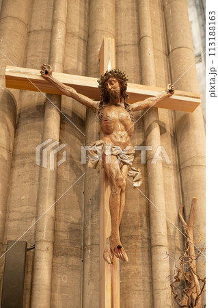 A statue of Jesus hanging from a cross 113188163
