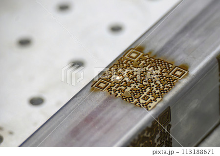 Close up scene the laser masking QR code on square tube. 113188671