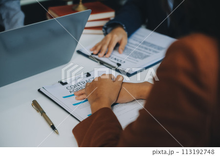 Businessman and lawyer discuss the contract document. Treaty of the law. Sign a contract business. 113192748
