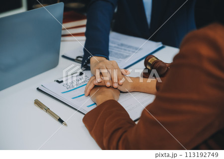 Businessman and lawyer discuss the contract document. Treaty of the law. Sign a contract business. Businessman and lawyer discuss the contract document. Treaty of the law. Sign a contract business. 113192749