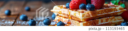 Indulge in the sweet harmony of waffles layered with ripe berries and drizzled with syrup, cafe menu 113193465