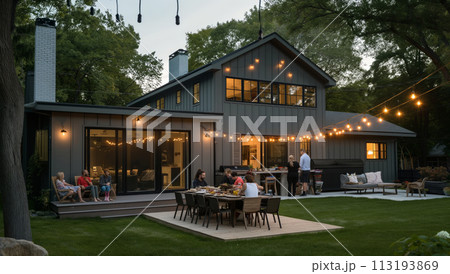 Group of People Sitting Around Table Outside House 113193869