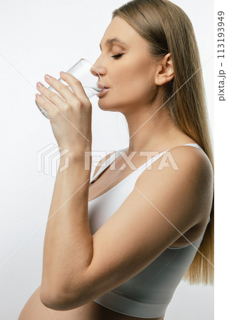 Close up of a young woman drinking water 113193949