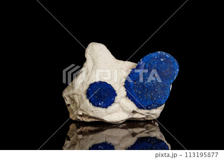 Macro mineral stone Azurite in siltstone against black background Macro mineral stone Azurite in siltstone against black background 113195877