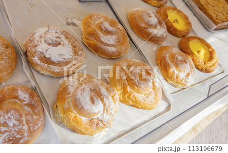 Golden-Brown Ensaimadas with a Creamy Heart, Traditional Balearic Delicacy 113196679