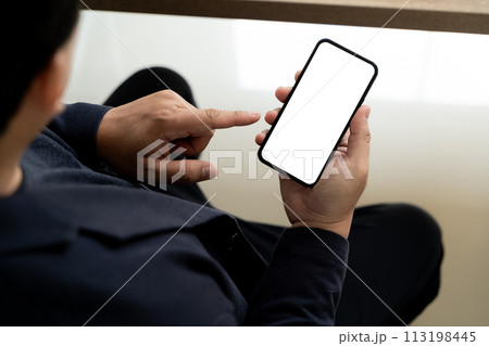 Top view Mockup image hand using a smartphone man Holding Cell Phone With Blank Screen Top view Mockup image hand using a smartphone man Holding Cell Phone With Blank Screen 113198445