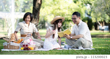 Grandparents enjoying with granddaughter in park and serenity. They are having joyful and cheerful time together. Loads of smile and happy moment Grandparents enjoying with granddaughter in park and serenity. They are having joyful and cheerful time together. Loads of smile and happy moment 113200023