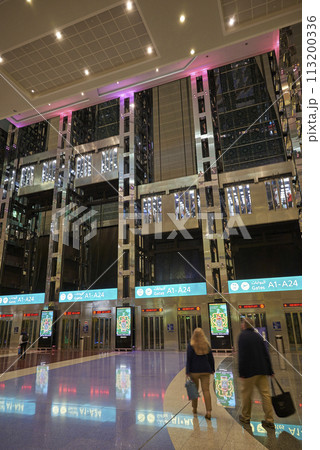 Interior of DXB Dubai International Airport terminal in Dubai, United Arab Emirates 113200336