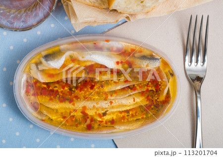 Marinated herring fillet in a plastic jar Marinated herring fillet in a plastic jar 113201704