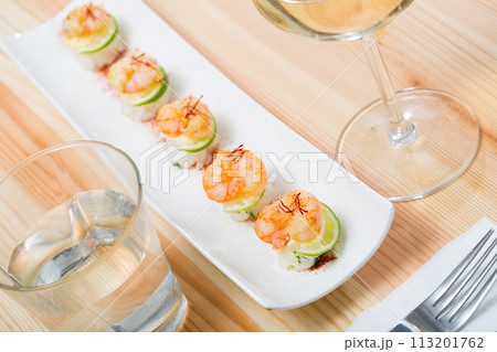 Roasted prawns on rice with saffron and lime 113201762
