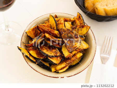 Fried eggplant with honey, classic Andalusian dish Fried eggplant with honey, classic Andalusian dish 113202212