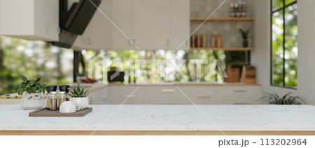 A white kitchen tabletop or kitchen island in a modern white and clean kitchen. 113202964