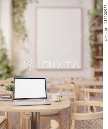 A laptop computer mockup on a wooden table in a beautiful minimalist restaurant of coffee shop. A laptop computer mockup on a wooden table in a beautiful minimalist restaurant of coffee shop. 113202973