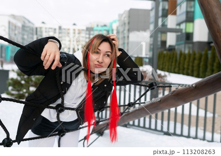 Lifestyle concept, Caucasian woman walking in the cold in the city 113208263