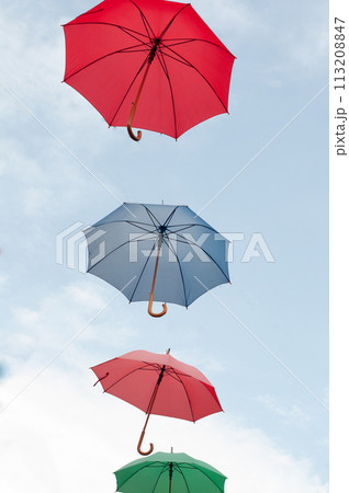 Many colorful umbrellas on the open sky 113208847