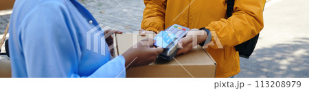 Header with woman paying for express delivery Header with woman paying for express delivery 113208979