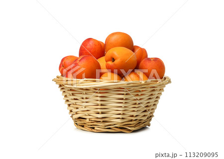PNG,Fresh apricots in a basket, isolated on white background 113209095