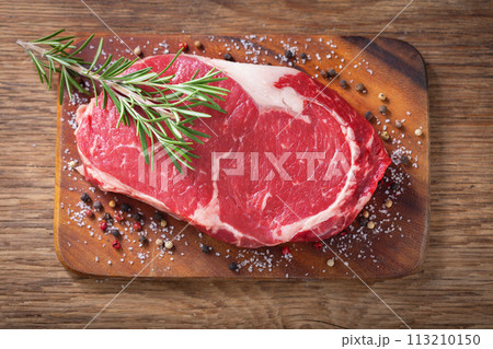 fresh meat with rosemary and spices, top view fresh meat with rosemary and spices, top view 113210150