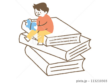 大きな本の上で読書する少年_色 113210303