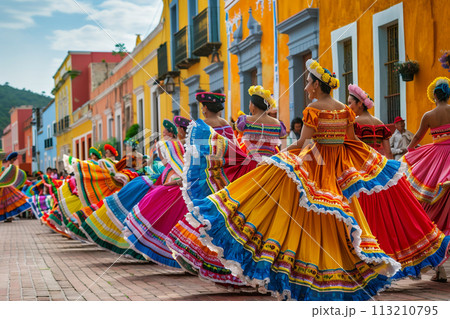 Cinco de Mayo concept - women in national dresses dancing during the carnival fiesta 113210795