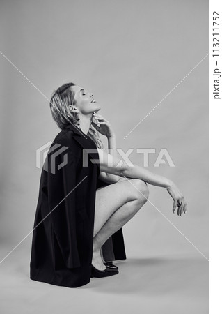 Beautiful woman with a long hair in a black jacket Beautiful woman with a long hair in a black jacket 113211752