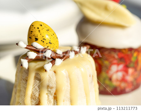 Traditional Easter cottage cheese dessert Paskha decorated with quail eggs and chocolate willow on tabletop background. Modern Orthodox Easter background with two mini cottage curd desserts Paskha Traditional Easter cottage cheese dessert Paskha decorated with quail eggs and chocolate willow on tabletop background. Modern Orthodox Easter background with two mini cottage curd desserts Paskha 113211773