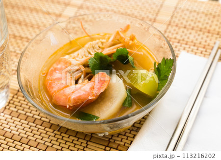 Thai soup with seafood and vegetables Thai soup with seafood and vegetables 113216202