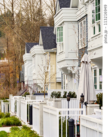 Frontside of brand new residential townhouses. Row of townhouses for sale Frontside of brand new residential townhouses. Row of townhouses for sale 113216949