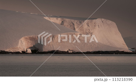 Lemaire strait coastal landscape, mountains and icebergs, Antarctic Peninsula, Antartica. Lemaire strait coastal landscape, mountains and icebergs, Antarctic Peninsula, Antartica. 113218390