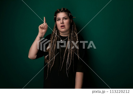 Woman With Dreadlocks Pointing at Something Woman With Dreadlocks Pointing at Something 113220212