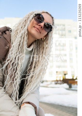 Woman With Long Blonde Hair and Sunglasses 113220269