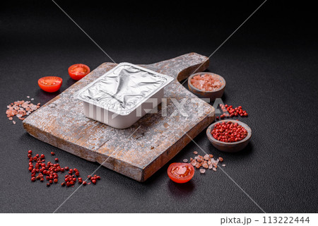 Rectangular plastic box with yogurt or cheese hermetically sealed with a foil lid Rectangular plastic box with yogurt or cheese hermetically sealed with a foil lid 113222444