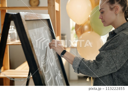 Drawing advert with chalk on blackboard Drawing advert with chalk on blackboard 113222855