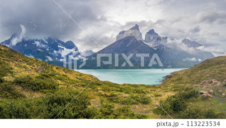 Majestic Mountain Landscape Overlooking a Turquoise Lake Majestic Mountain Landscape Overlooking a Turquoise Lake 113223534