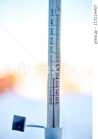 20 degrees below zero Celsius on outdoor thermometer, which is taped to window glass on street side. 20 degrees below zero Celsius on outdoor thermometer, which is taped to window glass on street side. 113224407