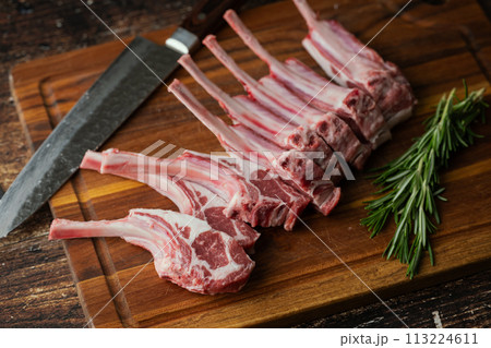 fresh lamb chop on wooden cutting board fresh lamb chop on wooden cutting board 113224611