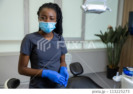 African american female dentist standing African american female dentist standing 113225273