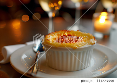 Creme brulee served in a classic ramekin, combination of creamy custard and caramelized sugar 113225596