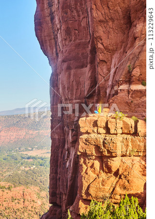 Sedona Sunset with Reflective Person on Cathedral Rock Cliffs 113229643