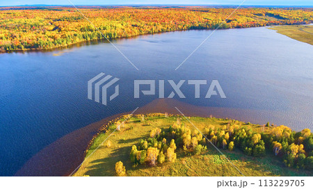 Aerial Autumn Foliage by Serene Lake in Houghton, Michigan 113229705