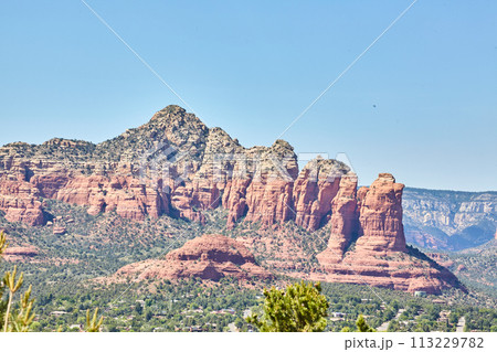 Sedona Red Rock Formations with Lush Vegetation and Town View 113229782