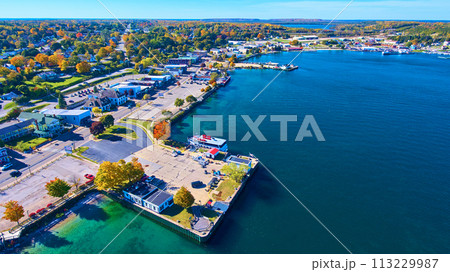 Aerial Autumn Lakeside Town with Boat Dock in Michigan 113229987
