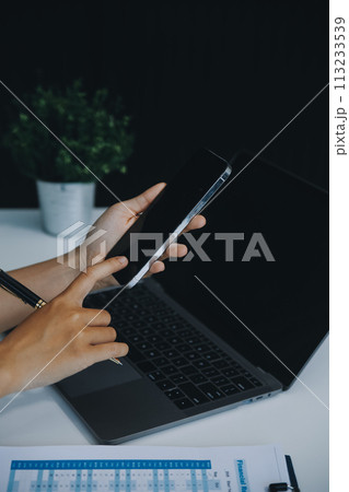 Excited happy Asian woman looking at the phone screen, celebrating an online win, overjoyed young asian female screaming with joy, isolated over a white blur background Excited happy Asian woman looking at the phone screen, celebrating an online win, overjoyed young asian female screaming with joy, isolated over a white blur background 113233539