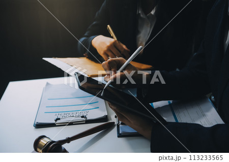 Businessman and Male lawyer or judge consult having team meeting with client, Law and Legal services concept. Businessman and Male lawyer or judge consult having team meeting with client, Law and Legal services concept. 113233565