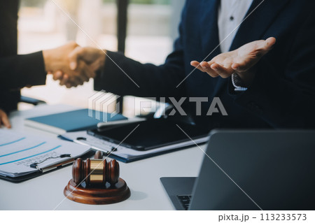 Businessman and Male lawyer or judge consult having team meeting with client, Law and Legal services concept. Businessman and Male lawyer or judge consult having team meeting with client, Law and Legal services concept. 113233573